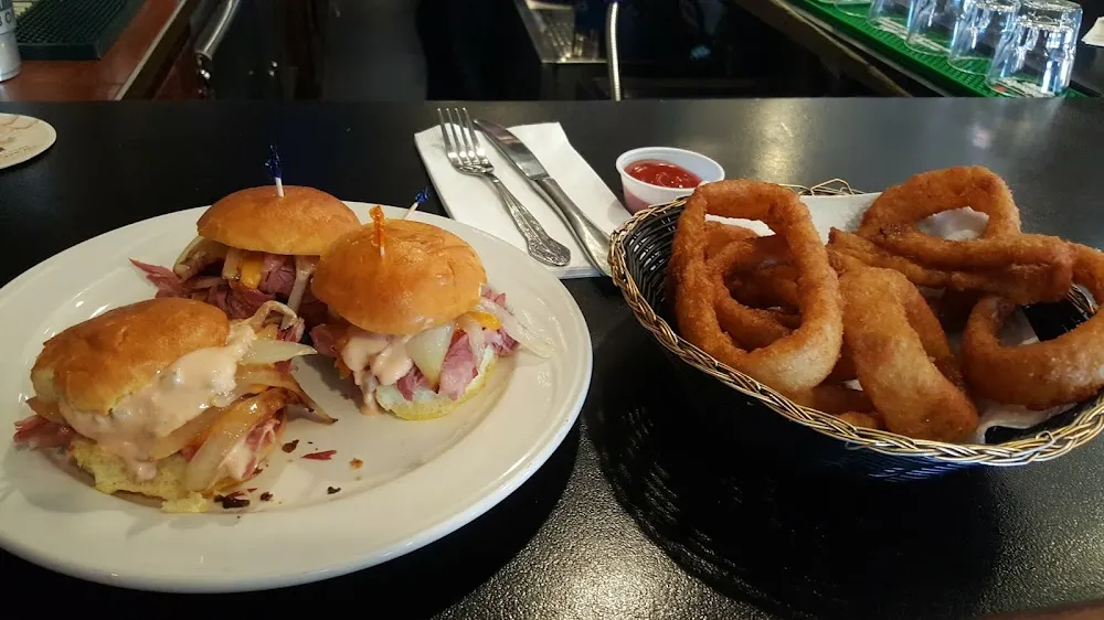 Oo Corned Beef Sliders with Sautéed Onions and Cheddar Cheese